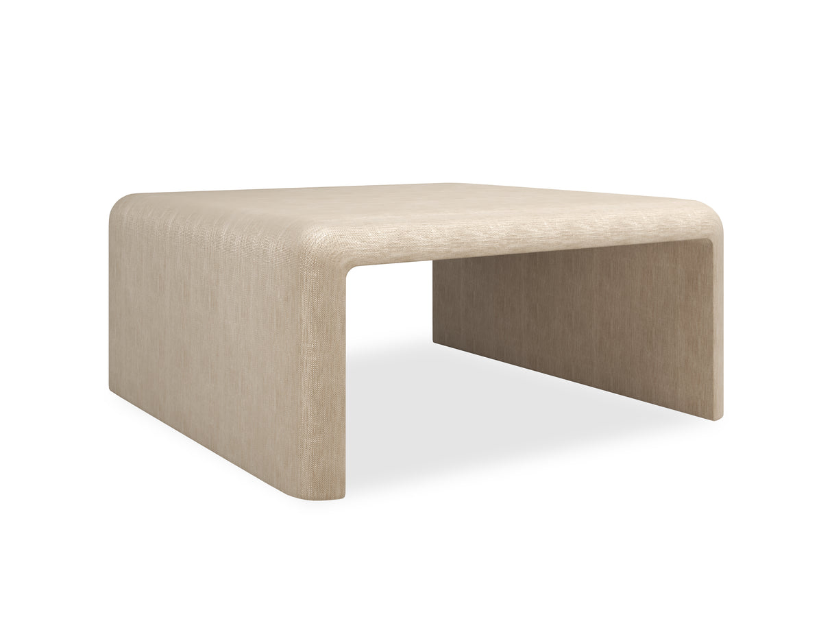 Oatmeal upholstered Coffee Table | Caracole Bridge the Gap