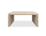 Oatmeal upholstered Coffee Table | Caracole Bridge the Gap